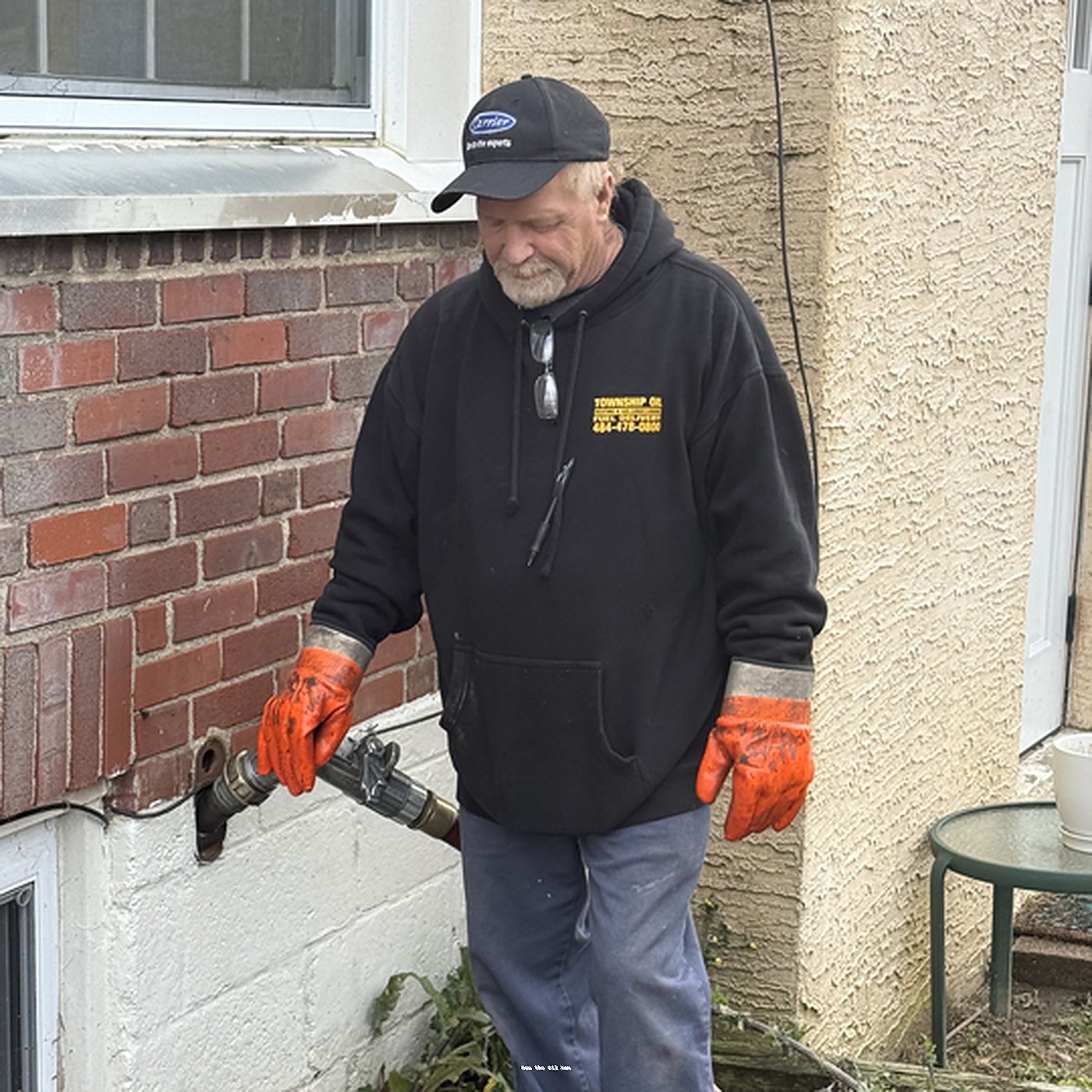 Danny Maginnis filling a residential oil tank at a Delaware County home
